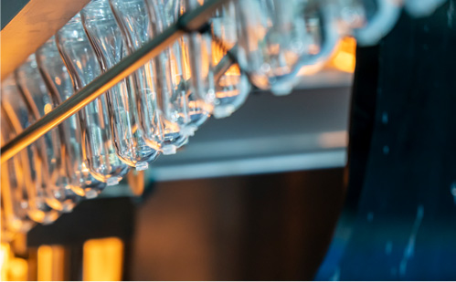 Glass bulbs in factory line by Currier